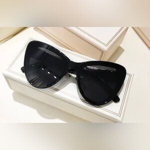 Y2K NWOT, oversized cat eye black sunglasses with gold trim.